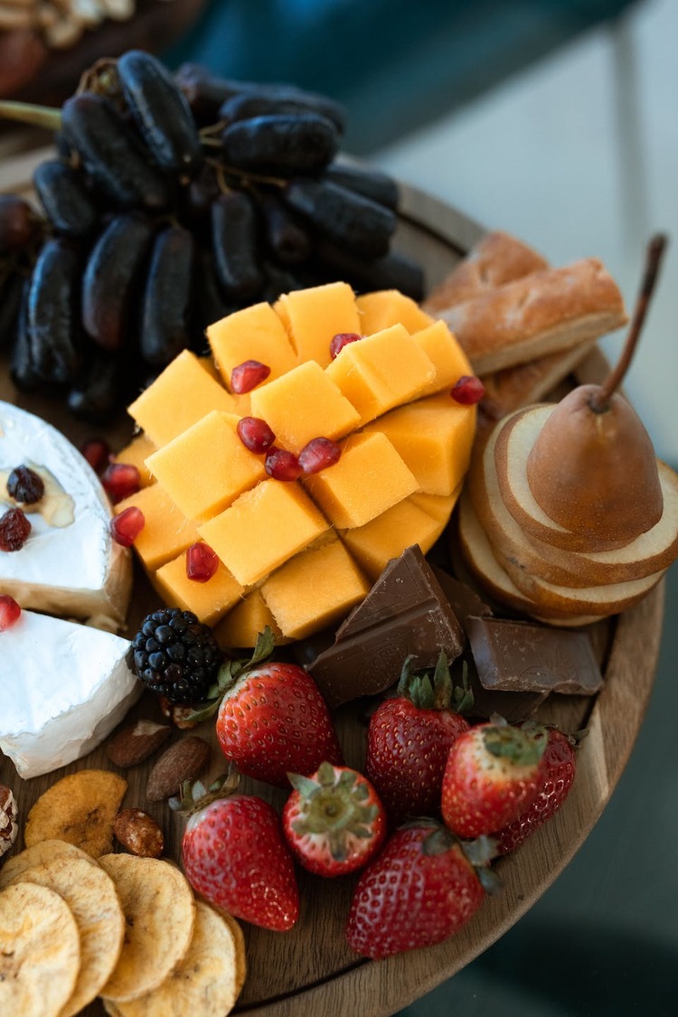 Sliced Pears, Mango, Brie Cheese, Berries and Milk Chocolate Charcuterie Board Recipe